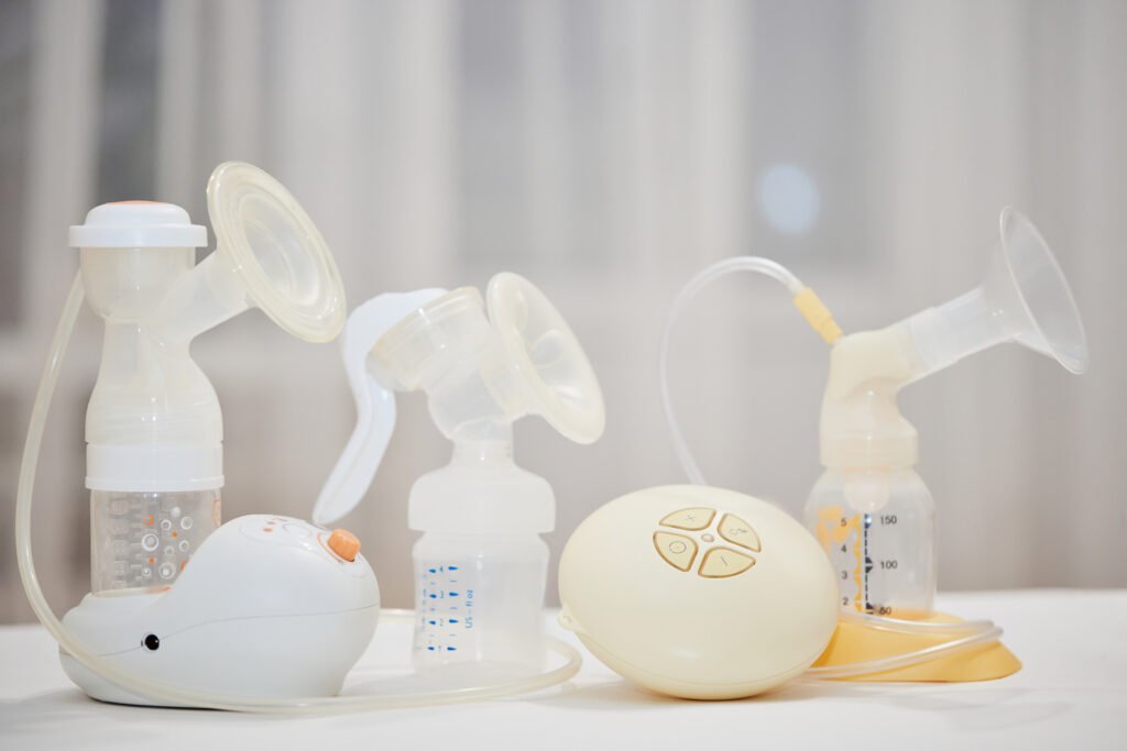 different breast pumps on table. maternity and child care.